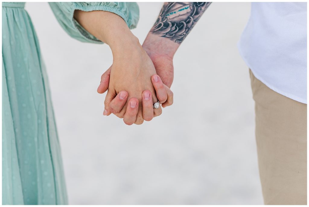 Close up of engaged couple holding hands showing off ring. Pensacola Beach Photographers - Jennifer Beal photography. 