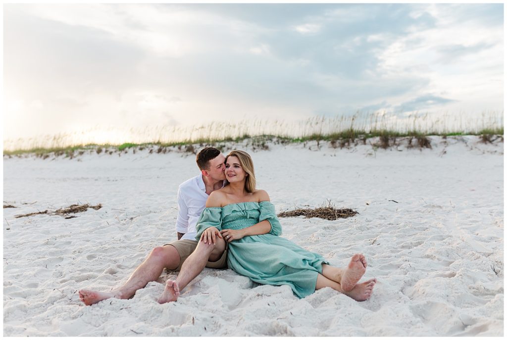 Couple sitting on beach during sunset. Jennifer Beal Photography Pensacola Beach photographer