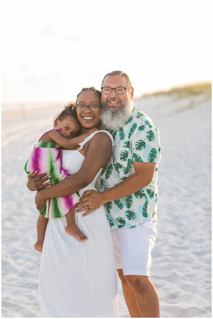 Couple with little girl posing at sunset on Pensacola Beach. Pensacola Beach Photography
