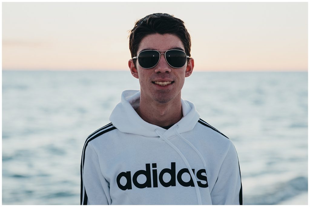 Young Man with sunglasses during sunset on Pensacola Beach. Pensacola Beach Photography 