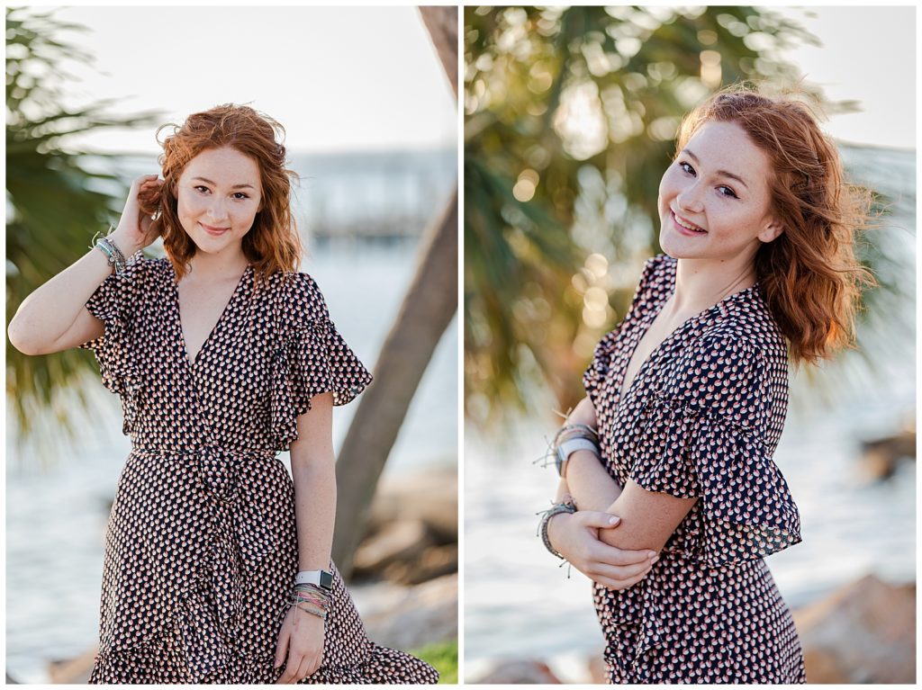 Senior girl poses by Pensacola Bay and palm trees during high school senior photo session. Pensacola Senior Photographer, Jennifer Beal Photography