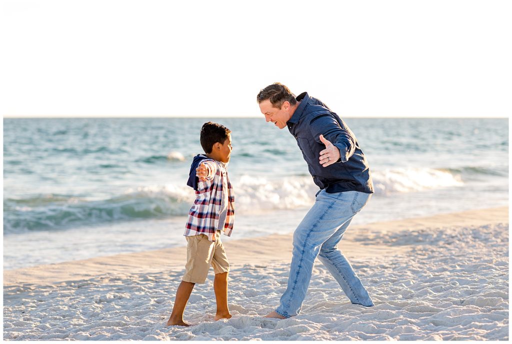 Father and son playing together on Pensacola Beach