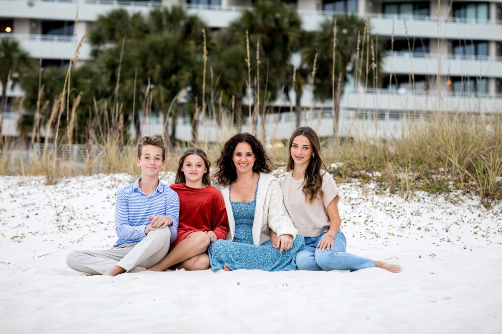 Pensacola Beach family vacation portrait session with mom and three teenage children.