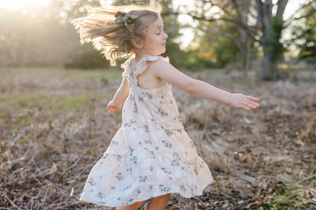 Little girl twirling during photo session