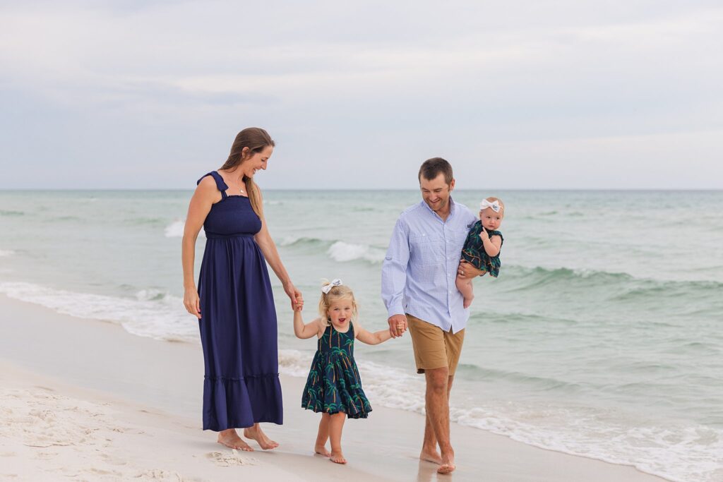 Family photo tips: Family of 4 on Pensacola Beach during photo session by Jennifer Beal Photography